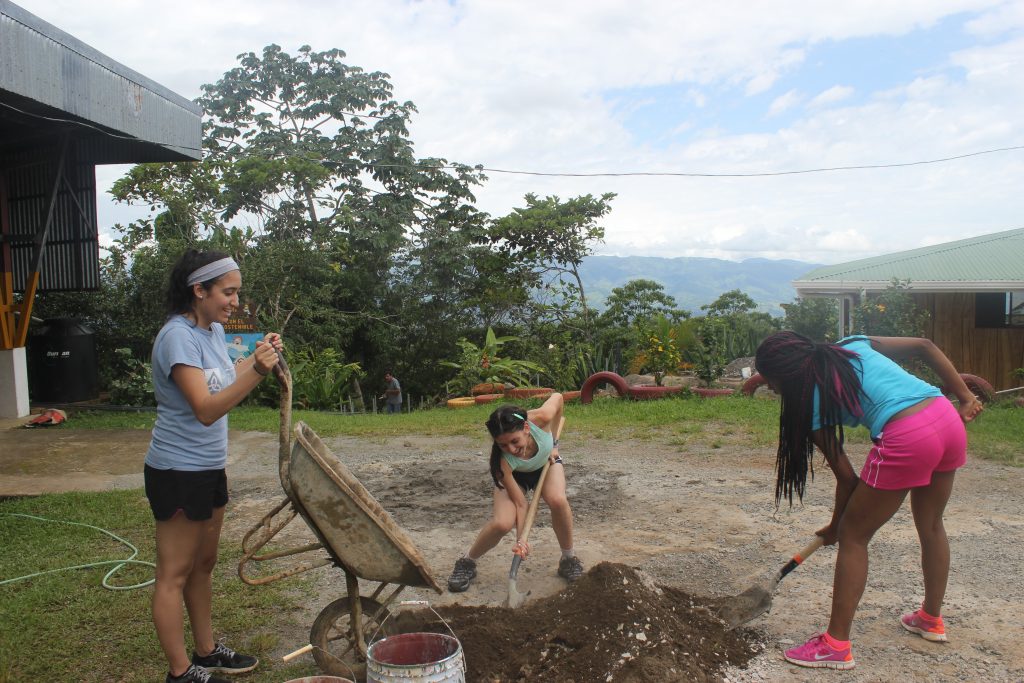Sand + cement mix + sweat = Teamwork!